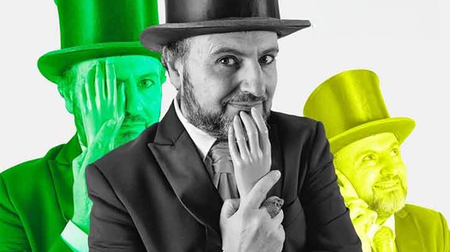 Cartel del show de Nano Arranz en Valladolid, con el artista en primer plano usando chistera y un gesto cómico con una mano de plástico, con fondos de colores verde y amarillo.